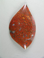 traded Dino Bone 411T  :  Such a bright Red Orange color.  There were 2 slabs of this bone and some great cabs as a result.  This stone also features some nice Yellow accents.