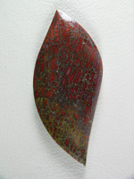 traded Dino Bone 416T  :  Beautifully cut shape of highly agatized Bone.  The std. Reds and Golds but a very pretty cab.