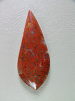 traded Dino Bone 420T  :  Such a bright Red Orange color.  There were 2 slabs of this bone and some great cabs as a result.  This stone also features some nice Yellow accents.