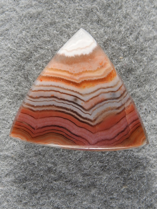 Dryhead Agate 1712 : A triangle of Dryhead with colors from Orange to Pinks, Greys Quartz and Whites, quite the spectrum.