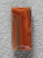 Dryhead Agate 1709 : Deep Orange to Browns in this Dryhead Rectangle.  Mirror finish.