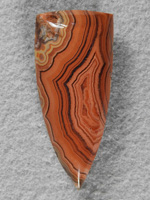 Dryhead Agate 439  :  A gemmy stone that has great bands and detail but stays primarily in the Oranges.  A great stone fro a pendant.