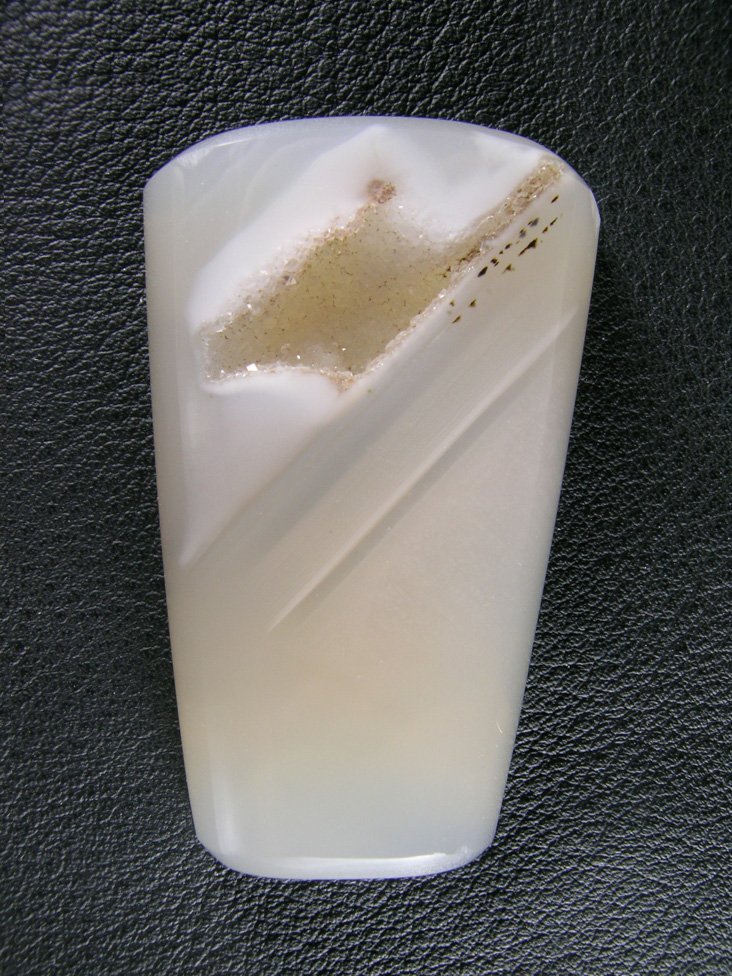 Horse Canyon Agate 736  :  Clear Agate with White Opal bands is the most common material there.  The prizes are the pieces with dendrites.  This one also has a druzy pocket.