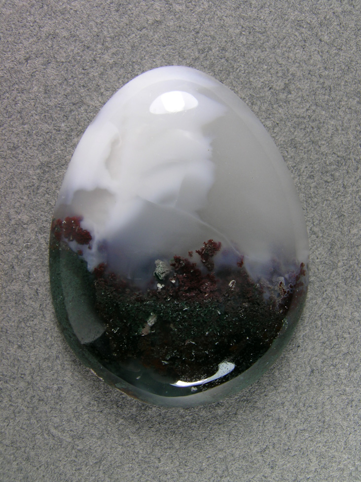 Horse Canyon Moss Agate 749  :  White clouds coming over the reddish trees and the green hills in this pretty traditional teardrop.