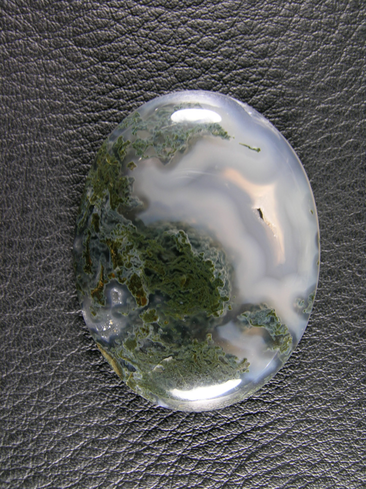 Horse Canyon Moss Agate 764  :  A beautiful Moss Agate cab.  A milky swirl to one side that looks like it should Iris with a small druzy pocket in the center