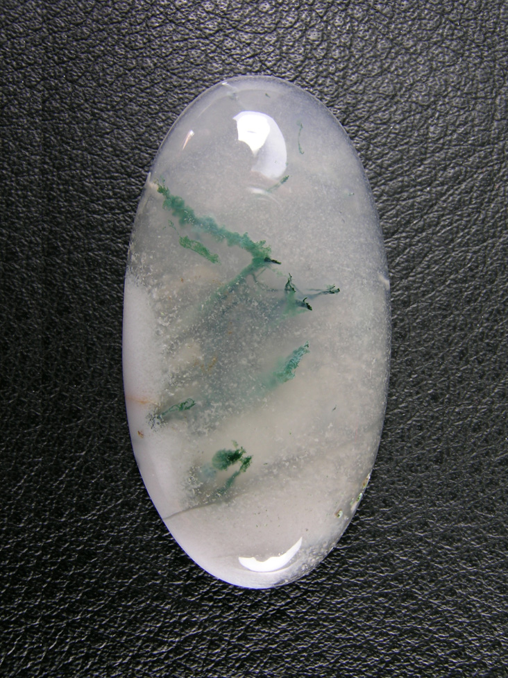 Horse Canyon Moss Agate 766  :  Looks like it is snowing on these pine tree branches.  Like a snow globe!  What a pretty cab.