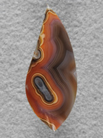 Laguna Agate 50  :  An unusual color combo from the Lagunas I have been fortunate enough to cut.  The bright colors framed in the darker bands make this an exciting stone.