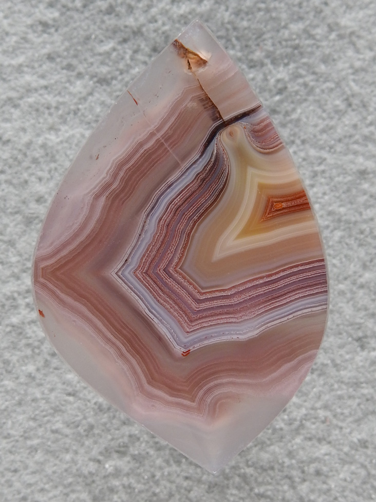Laguna Agate 63  :  Multi color and gemmy bands in yet another nice Laguna.  Only problem in this one is the healed fracture at top that obviously trapped some Iron.