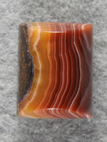 Laguna Agate 1487 : Love the Orange to Red tight bands in this stone by cutting only outter bands of larger slab. A high dome Bar cut.