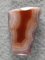 Laguna Agate 1492 : That Red in center is like blood and shadow in the outter bands. High polish completes this stone just waiting for a necklace.