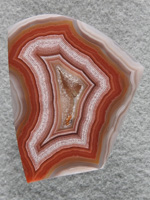 Laguna Agate 1882 :  A fairly large cab with great patterns and a nice druzy center.  A Glossy finish.