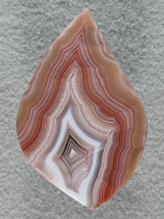 Laguna Agate 52  :  A very large cab of Laguna Agate.  Such pleasing bands and color combos like a big pink flame.
