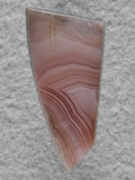 Laguna Agate 60  :  A small gemmy pink cab with very tight bands.