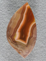 Laguna Agate 62  :  I had 2 slabs of this stone and both made exceptional cabs.  Gemmy and a great shadow effect like many of the Lagunas.