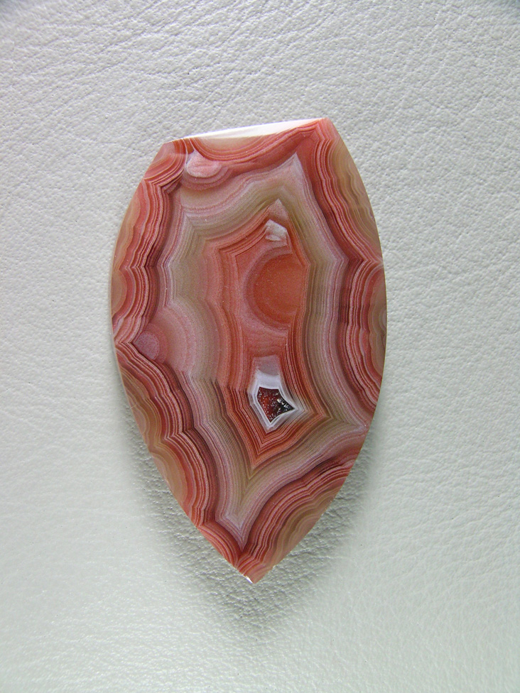 Traded Laguna Agate 119T  :  A more pastel color range cab.  I am not sure if this isn't a Moctazuma instead of Laguna.  Tight bands and great shadow.