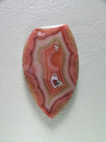 Traded Laguna Agate 119T  :  A more pastel color range cab.  I am not sure if this isn't a Moctazuma instead of Laguna.  Tight bands and great shadow.