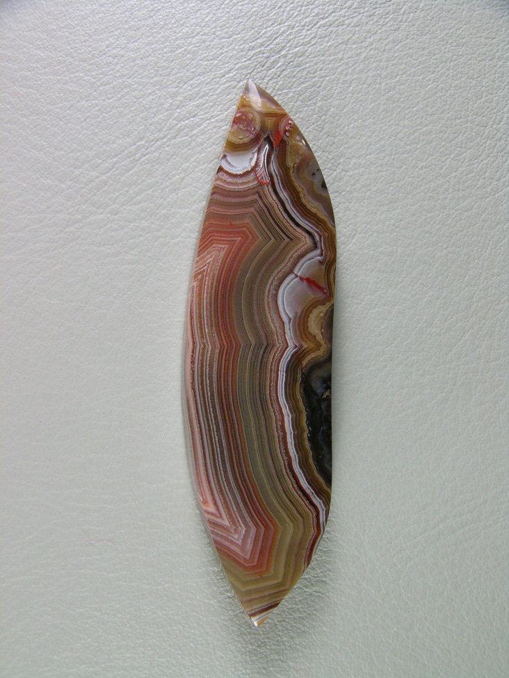 Traded Laguna Agate 126T  :  Super tight bands set off this nice cab in a multitude of colors.