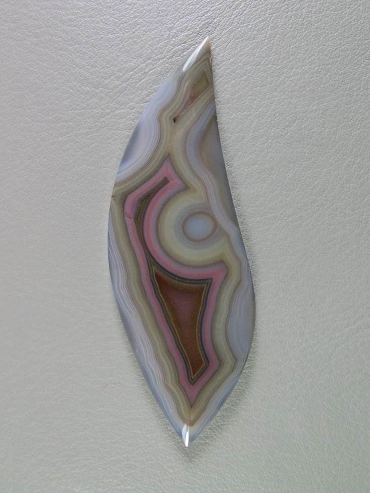 Traded Laguna Agate 127T  :  A thin cab but highly unusual colors and all in pastels.  Very unique.