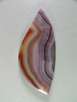 Traded Laguna Agate 122T  :  Another gemmy cab from a classic location.  The tight bands and color and I cut the shape to play on the Red border which worked out perfectly.