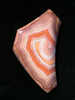 Traded Laguna Agate 128T  :  Another early cut on shares stone and subject also to the direct sun photograph.  This stone with the Oranges and Tans and the Evil Eye.  Filp it and it was a Sad Eye.