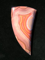 Traded Laguna Agate 141T  :  One of my early cuts on shares it was a huge cab probably 90 x 45.  Was shot last minute in direct sun, sorry for bad photo.