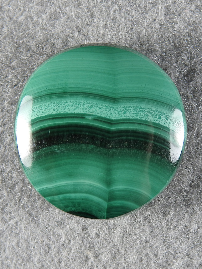 Malachite 1660 : This round is cut more froma seam Malachite but with some great bands.