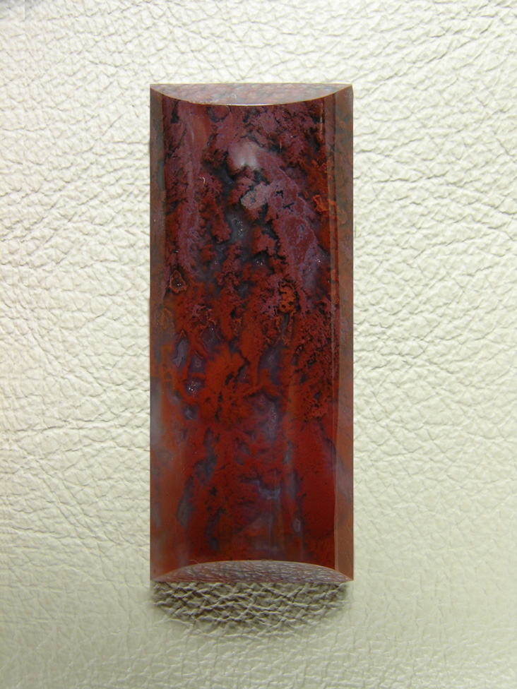 Coronary Plume Agate 642  :  An elongated half barrel this cab would make an excellent necklace.  It has well defined plumes from Red to Plum.