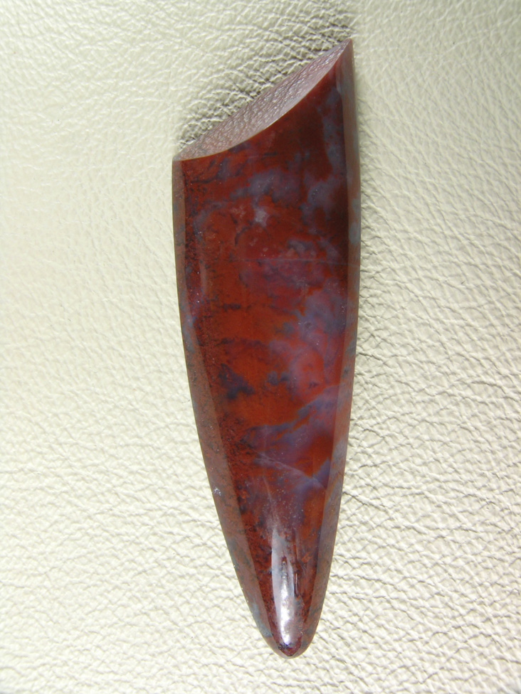 Coronary Plume Agate 647  :  Soft base and sharp top work well of the cut.  The Plumes make a nice color change and Blues in the base.