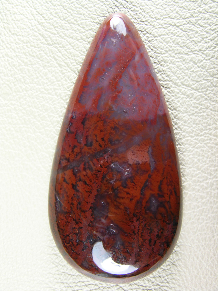Coronary Plume Agate 649  :  An excellent example of the Plumes.  This cab came from the deeper sections of the seam 4 to 5 feet which stated with the sharp color change to Blues.