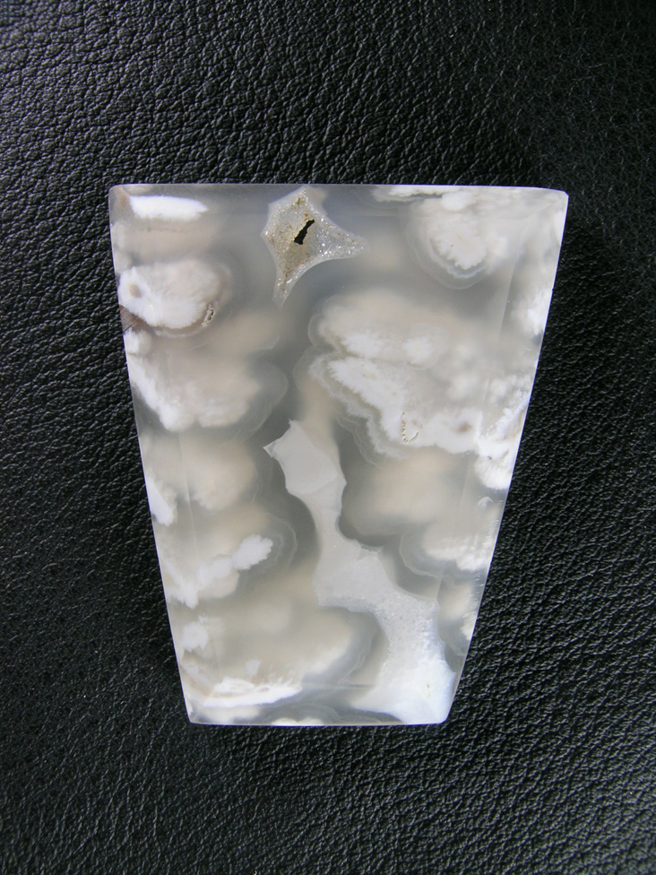 Icicle Agate 629  :  Geometric cab of Icicle Agate ith water clear Agate and White Opal plumes and a floater coming up thru the center.