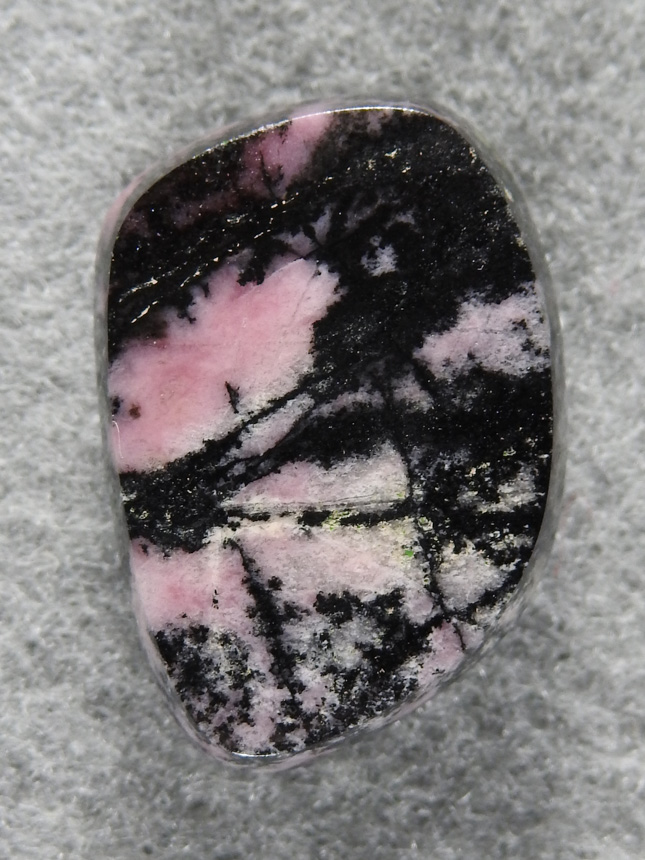 Rhodochrosite 1532 : A very nice freeform of Rhodonite. I love the contrast of the pink and Black in this material.