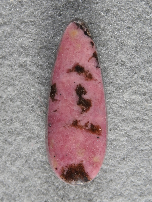 Rhodochrosite 1537 : Gemmy Rhodonite teardrop with brown inclusions