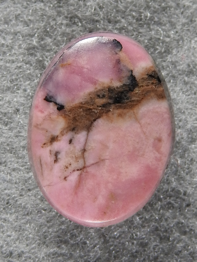 Rhodochrosite 1538 Pink oval with a nice Brown zone in a very nice Rhodonite