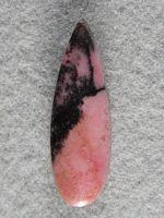 Rhodochrosite 1536 : A very nice teardrop of Rhodonite. I love the contrast of the pink and Black in this material.