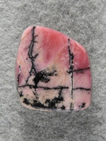 Rhodochrosite 1541 : A very nice freeform of Rhodonite. I love the contrast of the pink and Black in this material.